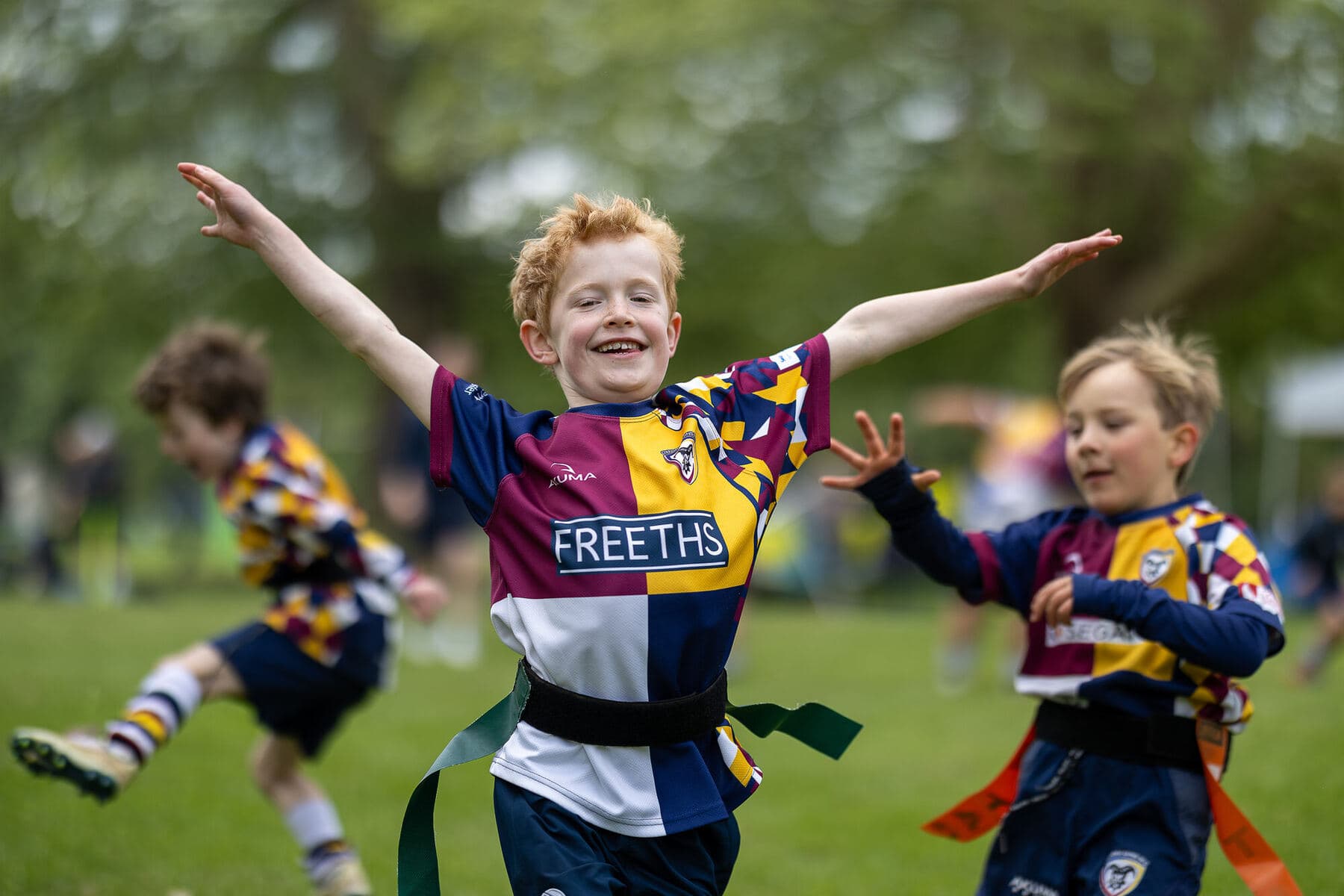 A young player celebrating at a Revel festival